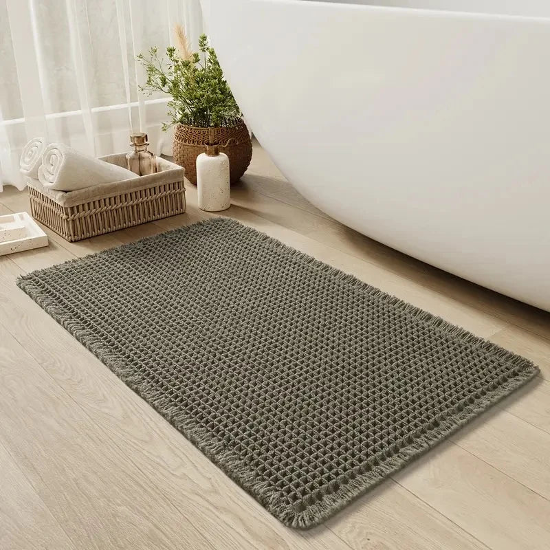 Non-slip textured waffle bath mat designed for quick-drying and enhanced safety, perfect for bathrooms and preventing slips. 1