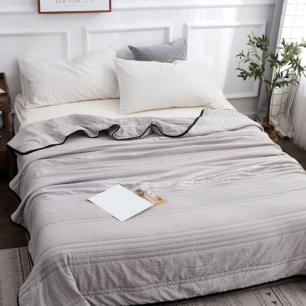 Cooling sleep blanket designed for comfort and breathability, featuring moisture-wicking fabric and a lightweight design for a restful night's sleep. 0
