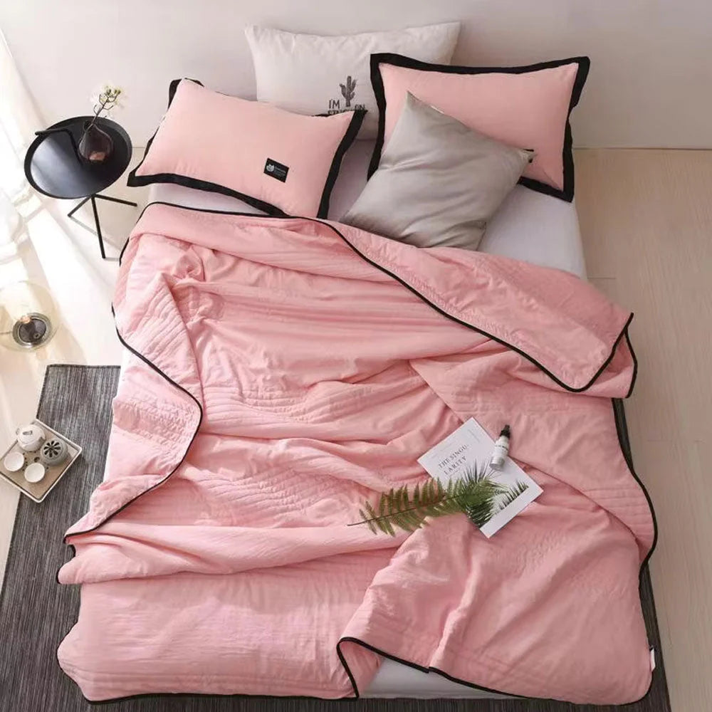 Cooling sleep blanket designed for comfort and breathability, featuring moisture-wicking fabric and a lightweight design for a restful night's sleep. 1