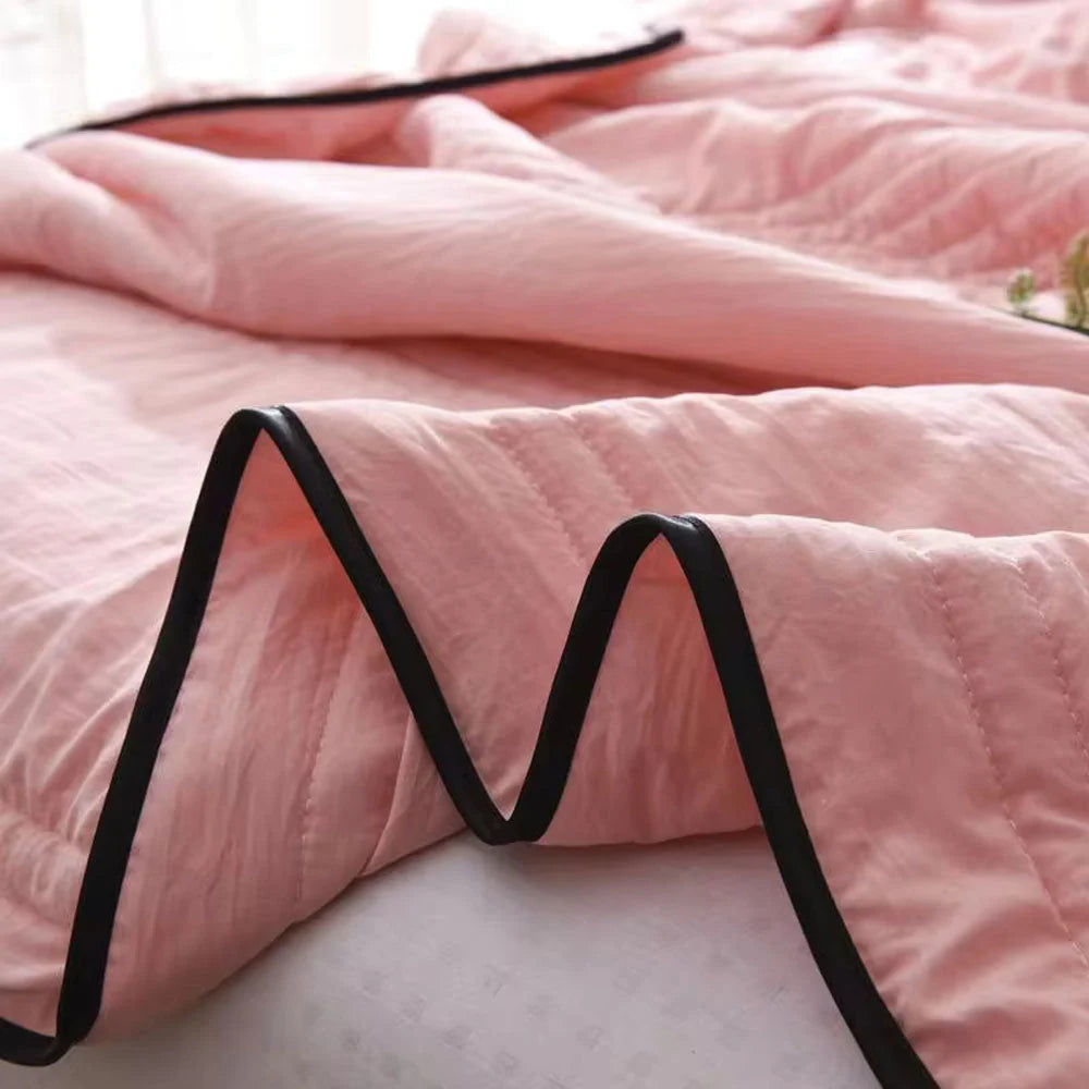 Cooling sleep blanket designed for comfort and breathability, featuring moisture-wicking fabric and a lightweight design for a restful night's sleep. 5