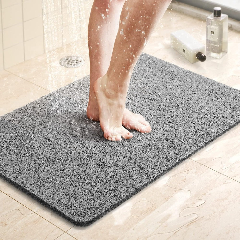 Non-slip antimicrobial shower mat with soft texture and drainage holes for optimal water flow, promoting safety and hygiene in bathrooms. 1