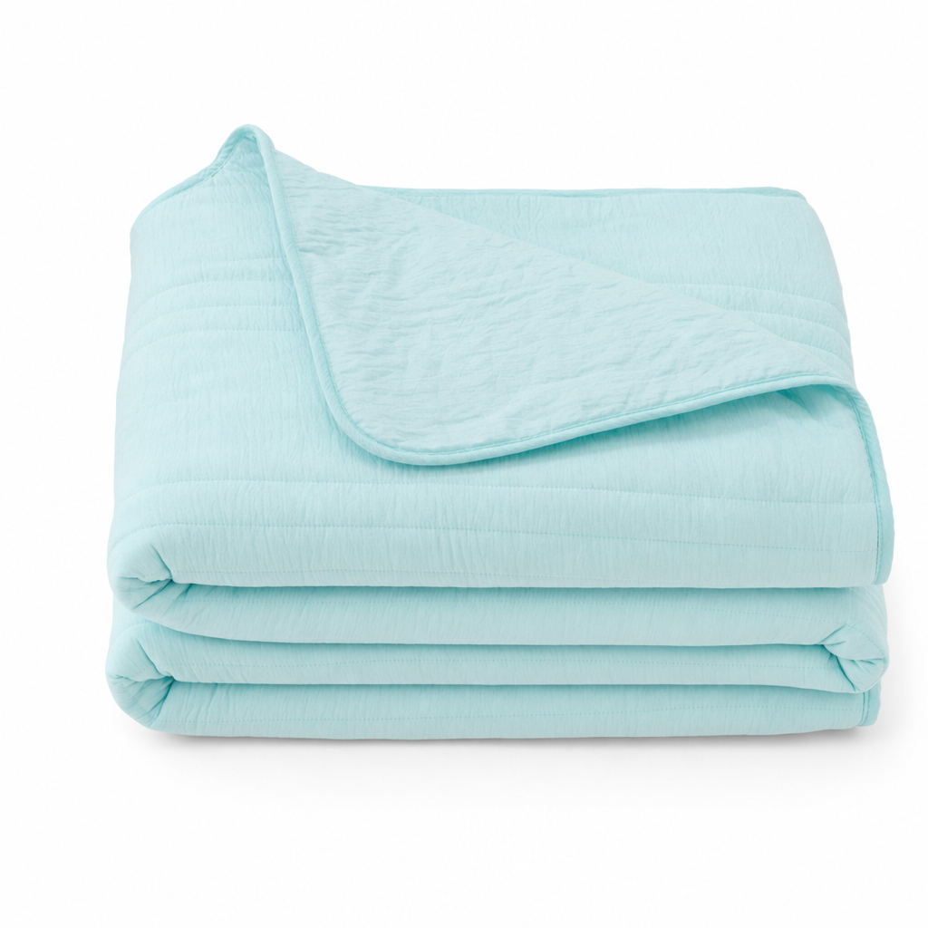 Cellvue cooling moisture-wicking blanket in Aquamarine, folded on a white background