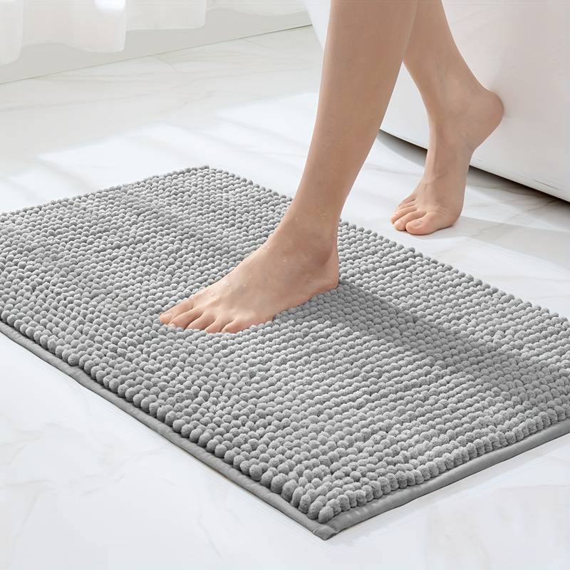 Non-slip chenille bath mat in a soft, plush texture, designed for quick-drying and superior comfort, ideal for enhancing bathroom safety and style. 0