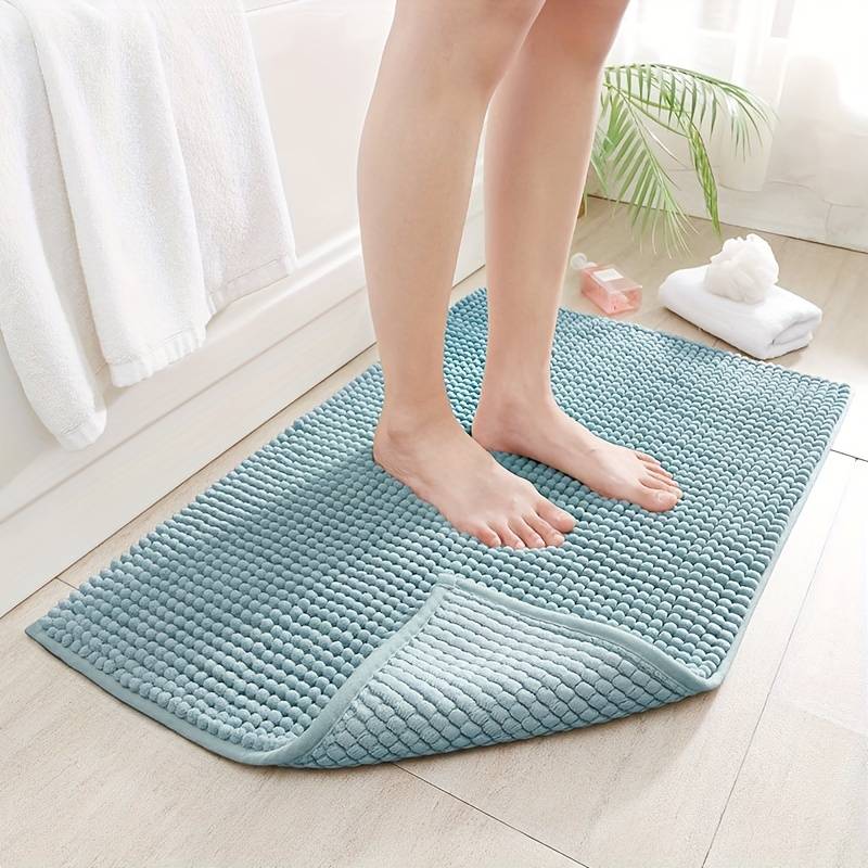 Non-slip chenille bath mat in a soft, plush texture, designed for quick-drying and superior comfort, ideal for enhancing bathroom safety and style. 1
