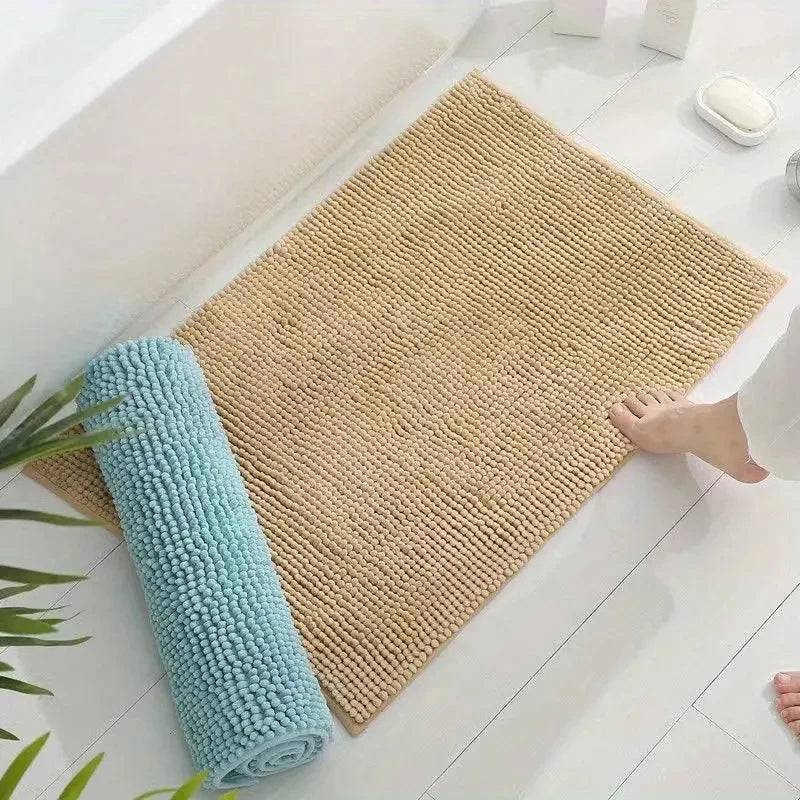 Non-slip chenille bath mat in a soft, plush texture, designed for quick-drying and superior comfort, ideal for enhancing bathroom safety and style. 2