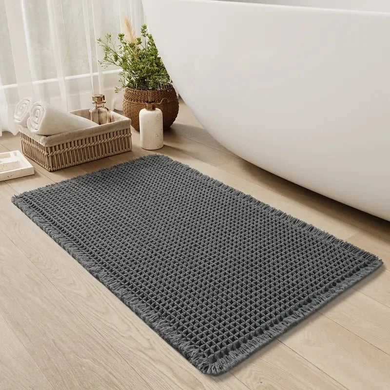 Non-slip textured waffle bath mat designed for quick-drying and enhanced safety, perfect for bathrooms and preventing slips. 6