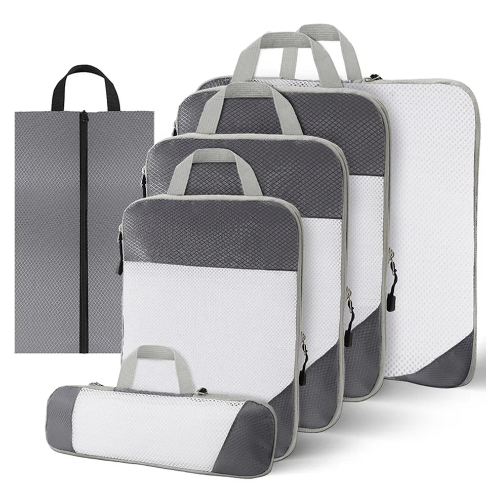 Set of 6 compression packing cubes for travel, featuring durable material and zippered compartments, designed to maximize luggage space and organize clothing efficiently. 10