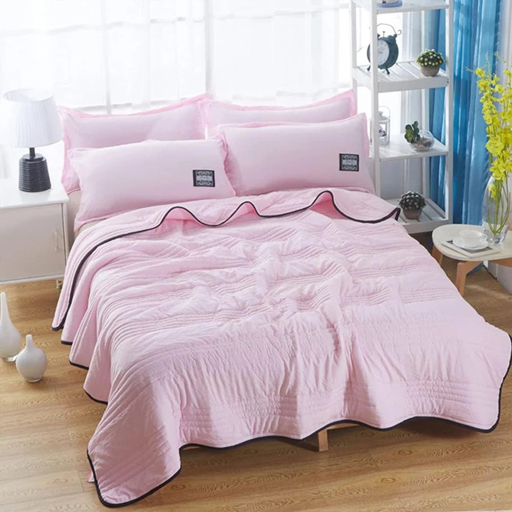 Cooling sleep blanket designed for comfort and breathability, featuring moisture-wicking fabric and a lightweight design for a restful night's sleep. 8
