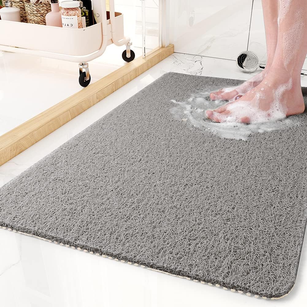 Non-slip antimicrobial shower mat with soft texture and drainage holes for optimal water flow, promoting safety and hygiene in bathrooms. 0